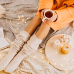 high-angle-woman-enjoying-winter-holidays-with-cup-tea_23-2148802754